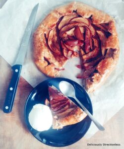 Apple galette sliced and served with ice cream