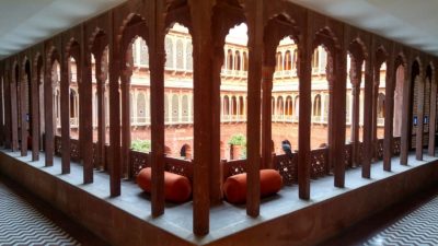 Curved arches and intricate jaalis along the corridors at Narendra Bhawan