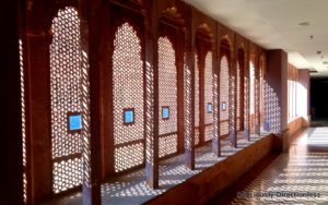 Curved arches and intricate jaalis along the corridors at Narendra Bhawan