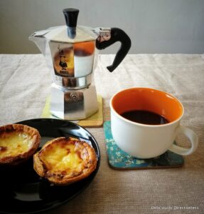 Moka Pot with coffee cup and pasteis de nata