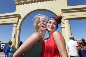 Smiling ladies in front of Arch 